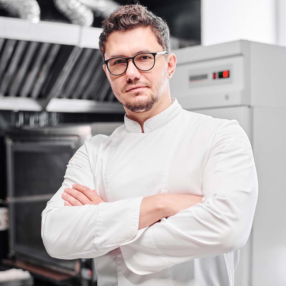 young-professional-chef-in-kitchen-HF8SK2Y.jpg